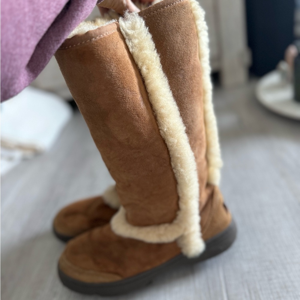 Brown suede Sunburst Tall UGG boots with cream fur trim #winterboots
